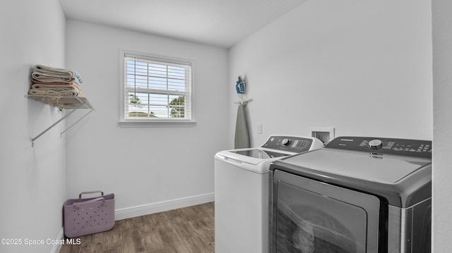 6830 Harp Ave, Cocoa, FL 32927 - washroom featuring washing machine and dryer and wood finished floors
