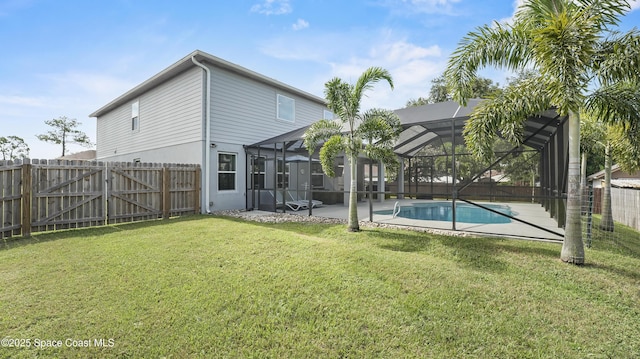 6830 Harp Ave, Cocoa, FL 32927 - back of house with a patio, a fenced backyard, and glass enclosure