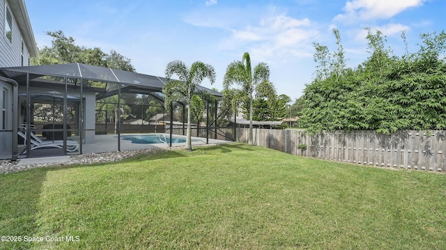 6830 Harp Ave, Cocoa, FL 32927 - fenced backyard with glass enclosure and a patio