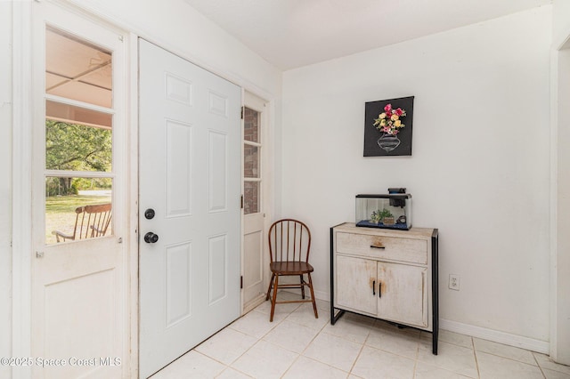 4685 Sand Point Rd, Grant, FL 32949 - foyer with light tile patterned flooring and baseboards