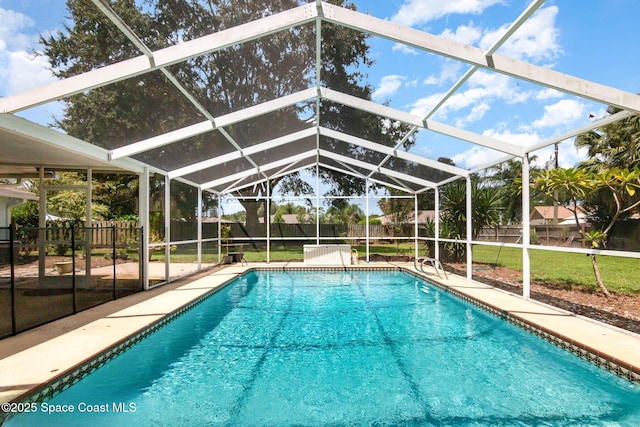 872 Bartel Ct, Rockledge, FL 32955 - outdoor pool featuring a fenced backyard, glass enclosure, and a patio