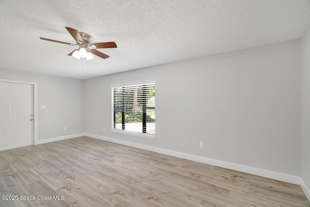 1256 16th Ave SW, Vero Beach, FL 32962 - unfurnished room featuring ceiling fan, a textured ceiling, and light wood-type flooring