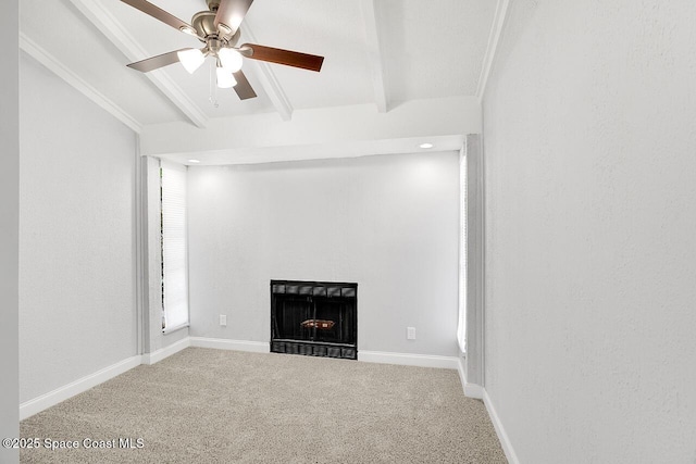 1256 16th Ave SW, Vero Beach, FL 32962 - unfurnished living room with beamed ceiling, a fireplace, carpet flooring, a ceiling fan, and crown molding
