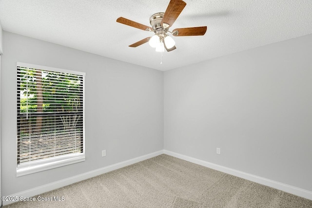 1256 16th Ave SW, Vero Beach, FL 32962 - unfurnished room with carpet flooring, ceiling fan, and a textured ceiling
