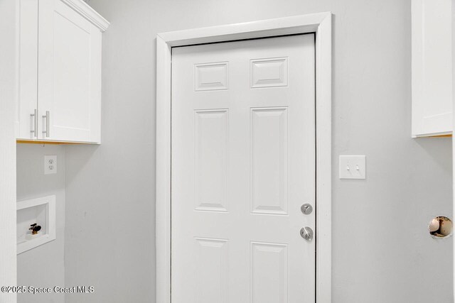 1256 16th Ave SW, Vero Beach, FL 32962 - laundry room with cabinet space and hookup for a washing machine