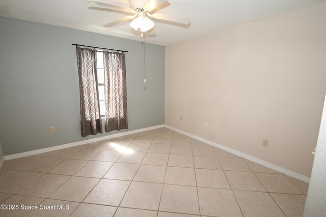 9027 Manchester Ln Unit 22F, West Melbourne, FL 32904 - spare room with ceiling fan and light tile patterned floors