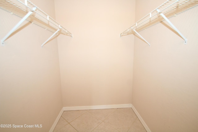 9027 Manchester Ln Unit 22F, West Melbourne, FL 32904 - spacious closet featuring light tile patterned flooring