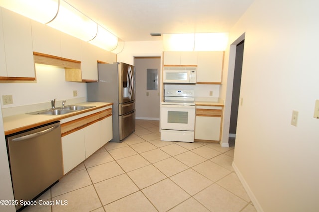 9027 Manchester Ln Unit 22F, West Melbourne, FL 32904 - kitchen featuring stainless steel appliances, light countertops, electric panel, and light tile patterned floors