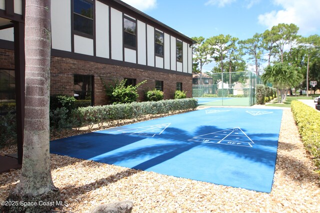 9027 Manchester Ln Unit 22F, West Melbourne, FL 32904 - surrounding community with shuffleboard