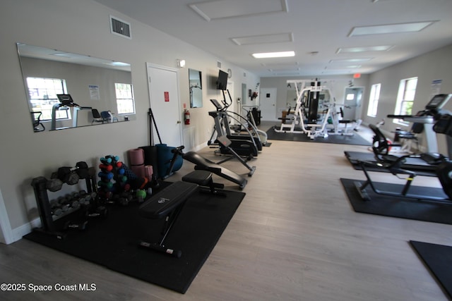 9027 Manchester Ln Unit 22F, West Melbourne, FL 32904 - workout area with wood finished floors and healthy amount of natural light