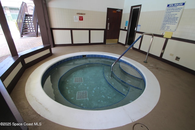 9027 Manchester Ln Unit 22F, West Melbourne, FL 32904 - view of swimming pool with a hot tub