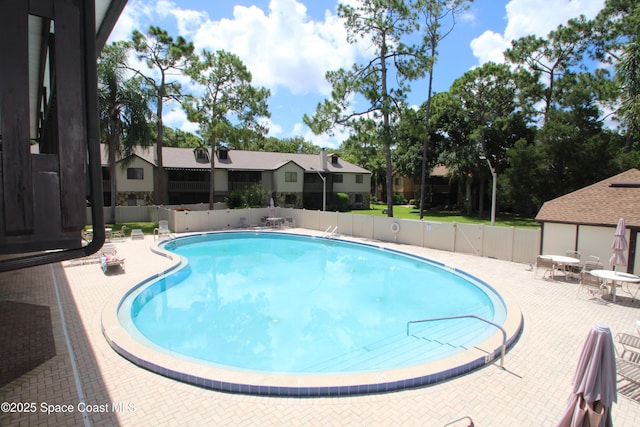 9027 Manchester Ln Unit 22F, West Melbourne, FL 32904 - community pool featuring a patio