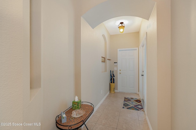 1869 Tullagee Ave, Melbourne, FL 32940 - corridor featuring arched walkways and light tile patterned flooring