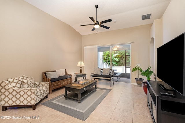 1869 Tullagee Ave, Melbourne, FL 32940 - living room featuring a ceiling fan, light tile patterned flooring, and high vaulted ceiling