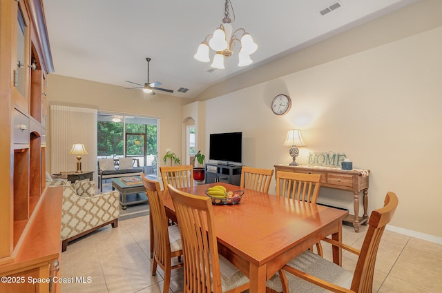 1869 Tullagee Ave, Melbourne, FL 32940 - dining area featuring light tile patterned flooring, vaulted ceiling, ceiling fan, and a chandelier