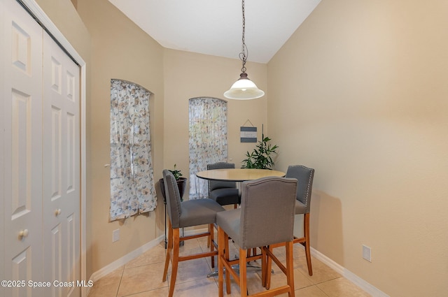 1869 Tullagee Ave, Melbourne, FL 32940 - dining room with light tile patterned flooring and baseboards