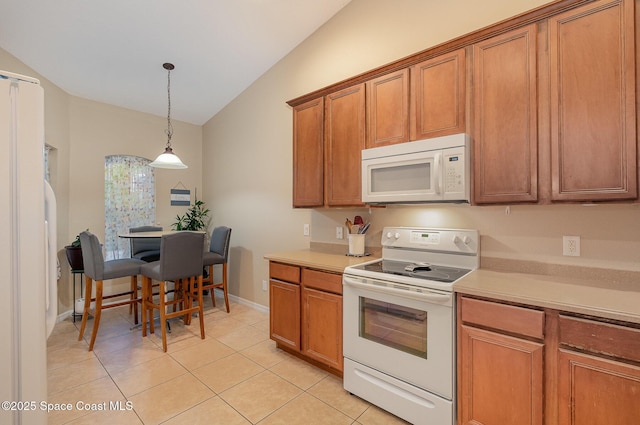 1869 Tullagee Ave, Melbourne, FL 32940 - kitchen featuring white appliances, brown cabinetry, vaulted ceiling, light countertops, and decorative light fixtures