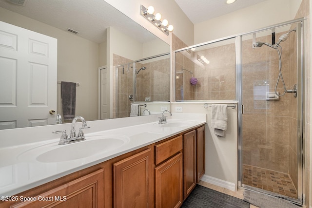 1869 Tullagee Ave, Melbourne, FL 32940 - bathroom featuring double vanity and a shower stall