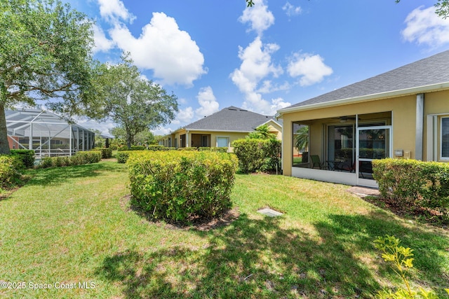 2690 Camberly Cir, Melbourne, FL 32940 - view of grassy yard featuring a sunroom