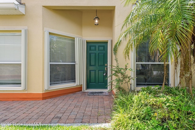 2690 Camberly Cir, Melbourne, FL 32940 - property entrance featuring stucco siding