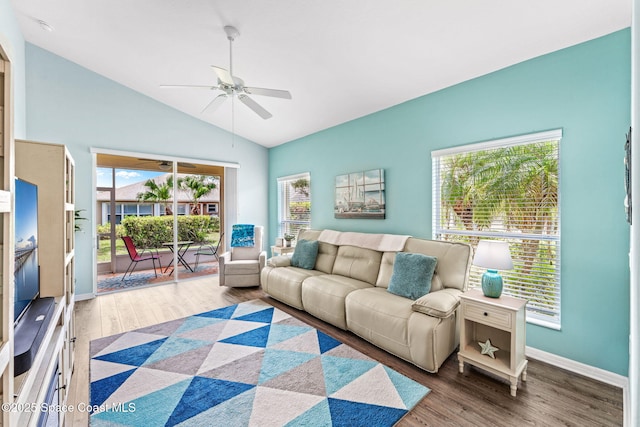 2690 Camberly Cir, Melbourne, FL 32940 - living area with a ceiling fan, wood finished floors, healthy amount of natural light, and high vaulted ceiling