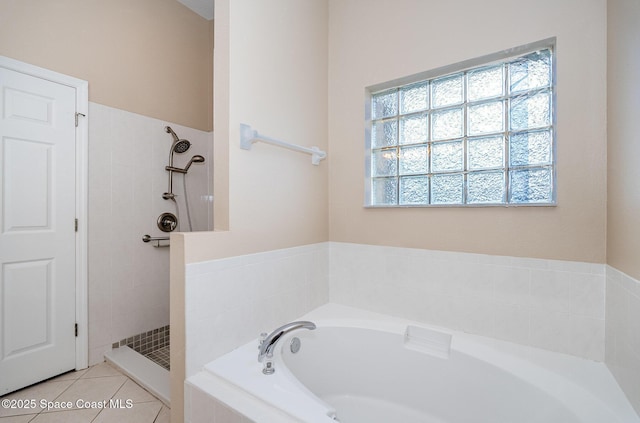 2383 Glasbern Cir, Melbourne, FL 32904 - full bathroom featuring a bath, a tile shower, and tile patterned floors