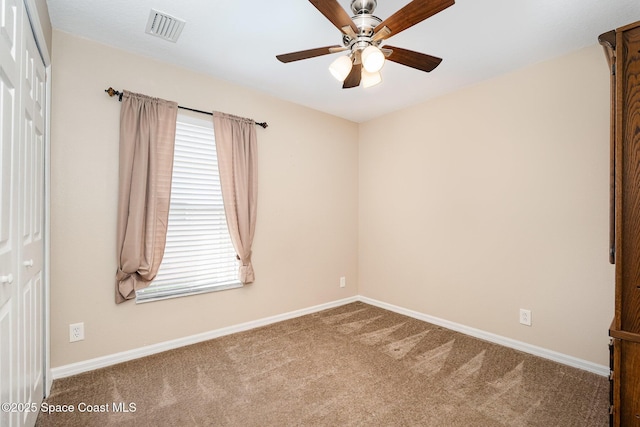 2383 Glasbern Cir, Melbourne, FL 32904 - carpeted spare room featuring a ceiling fan and baseboards