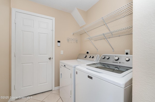 2383 Glasbern Cir, Melbourne, FL 32904 - laundry room featuring separate washer and dryer and light tile patterned flooring