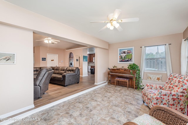 7045 Grissom Pkwy, Cocoa, FL 32927 - living area featuring ceiling fan and baseboards