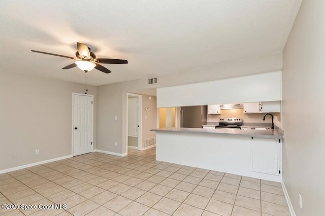 964 Mcfarlan Ave, Fort Walton Beach, FL 32547 - unfurnished living room featuring a ceiling fan and light tile patterned flooring