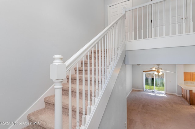 609 Cedar Side Cir NE, Palm Bay, FL 32905 - stairs featuring a high ceiling, carpet flooring, and a ceiling fan