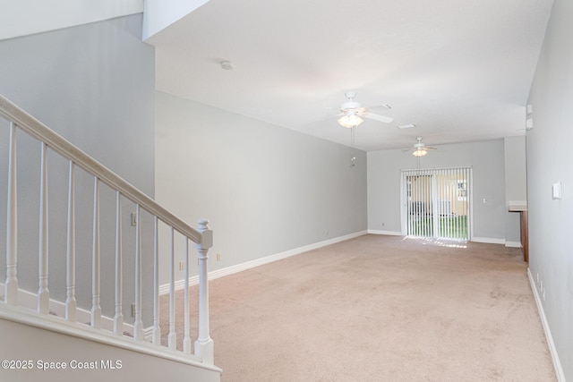 609 Cedar Side Cir NE, Palm Bay, FL 32905 - unfurnished living room featuring ceiling fan, carpet flooring, and stairway