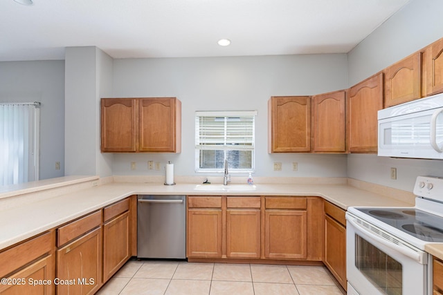609 Cedar Side Cir NE, Palm Bay, FL 32905 - kitchen with white appliances, light countertops, light tile patterned floors, brown cabinetry, and recessed lighting