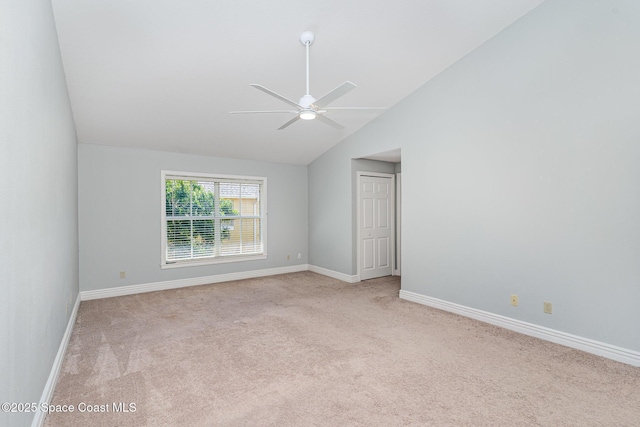 609 Cedar Side Cir NE, Palm Bay, FL 32905 - empty room featuring light colored carpet, ceiling fan, and vaulted ceiling