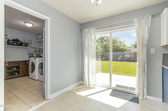 583 Mandan Ave, Melbourne, FL 32935 - laundry room featuring washing machine and clothes dryer and light wood-type flooring