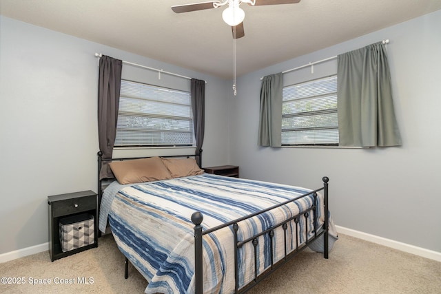 583 Mandan Ave, Melbourne, FL 32935 - carpeted bedroom with multiple windows and a ceiling fan