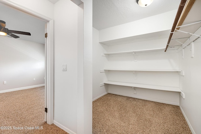 1708 Atlantic St Unit 4F, Melbourne Beach, FL 32951 - spacious closet featuring carpet floors and a ceiling fan
