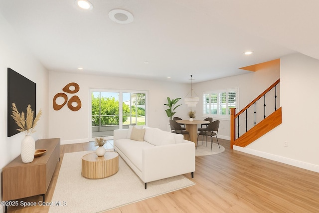1708 Atlantic St Unit 4F, Melbourne Beach, FL 32951 - living room featuring recessed lighting, light wood-style floors, and stairs
