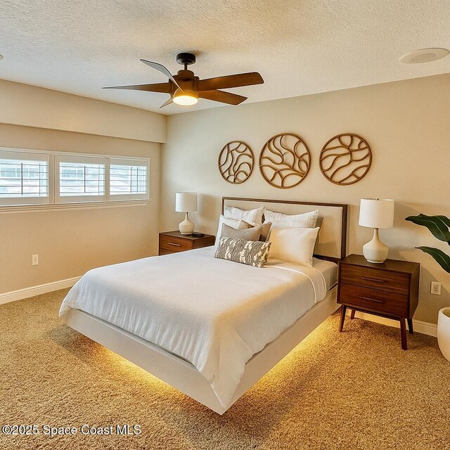 1708 Atlantic St Unit 4F, Melbourne Beach, FL 32951 - carpeted bedroom featuring a textured ceiling and ceiling fan