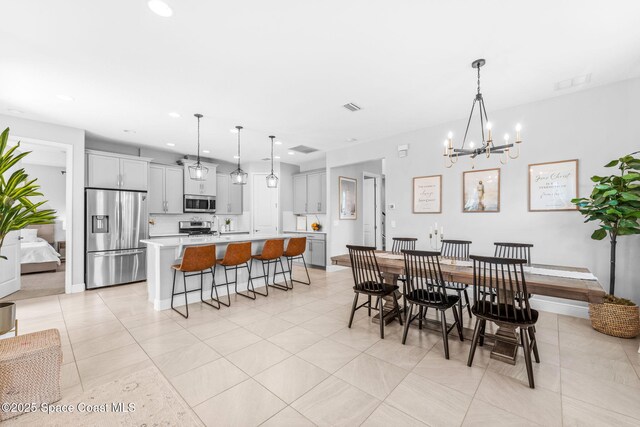 3089 Ribbon Grass Dr, Melbourne, FL 32940 - dining space featuring a chandelier, light tile patterned floors, and recessed lighting