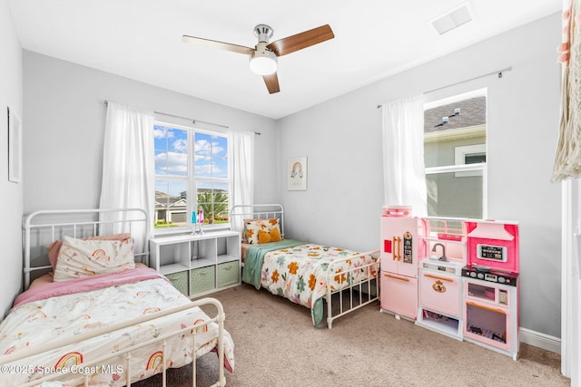 3089 Ribbon Grass Dr, Melbourne, FL 32940 - bedroom with light colored carpet and ceiling fan