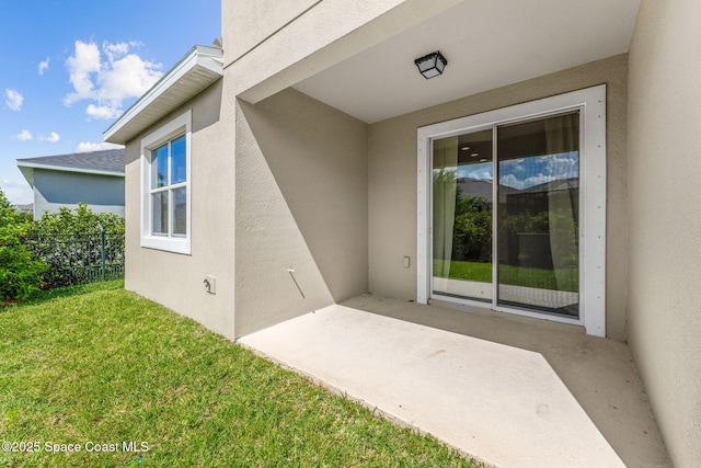 3089 Ribbon Grass Dr, Melbourne, FL 32940 - doorway to property featuring a patio and stucco siding