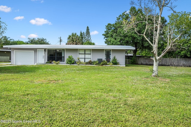 1056 Noreen Blvd, Rockledge, FL 32955 - ranch-style house with a garage and a metal roof