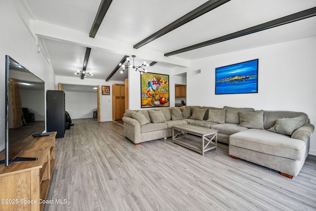 1056 Noreen Blvd, Rockledge, FL 32955 - living room with light wood-style floors, a chandelier, and beamed ceiling