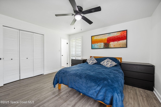 1056 Noreen Blvd, Rockledge, FL 32955 - bedroom featuring wood finished floors, a closet, and a ceiling fan