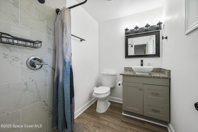 1056 Noreen Blvd, Rockledge, FL 32955 - full bathroom with a tile shower, vanity, and wood finished floors