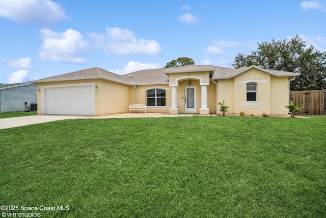 183 Frante Ave NE, Palm Bay, FL 32907 - view of front of property with stucco siding, driveway, and an attached garage