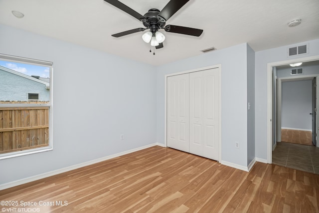 183 Frante Ave NE, Palm Bay, FL 32907 - unfurnished bedroom featuring light wood-type flooring, a closet, and ceiling fan