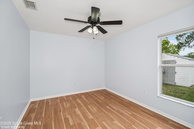 183 Frante Ave NE, Palm Bay, FL 32907 - empty room with wood finished floors and a ceiling fan