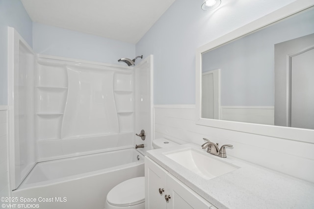 183 Frante Ave NE, Palm Bay, FL 32907 - full bathroom with vanity, shower / bathtub combination, and a wainscoted wall